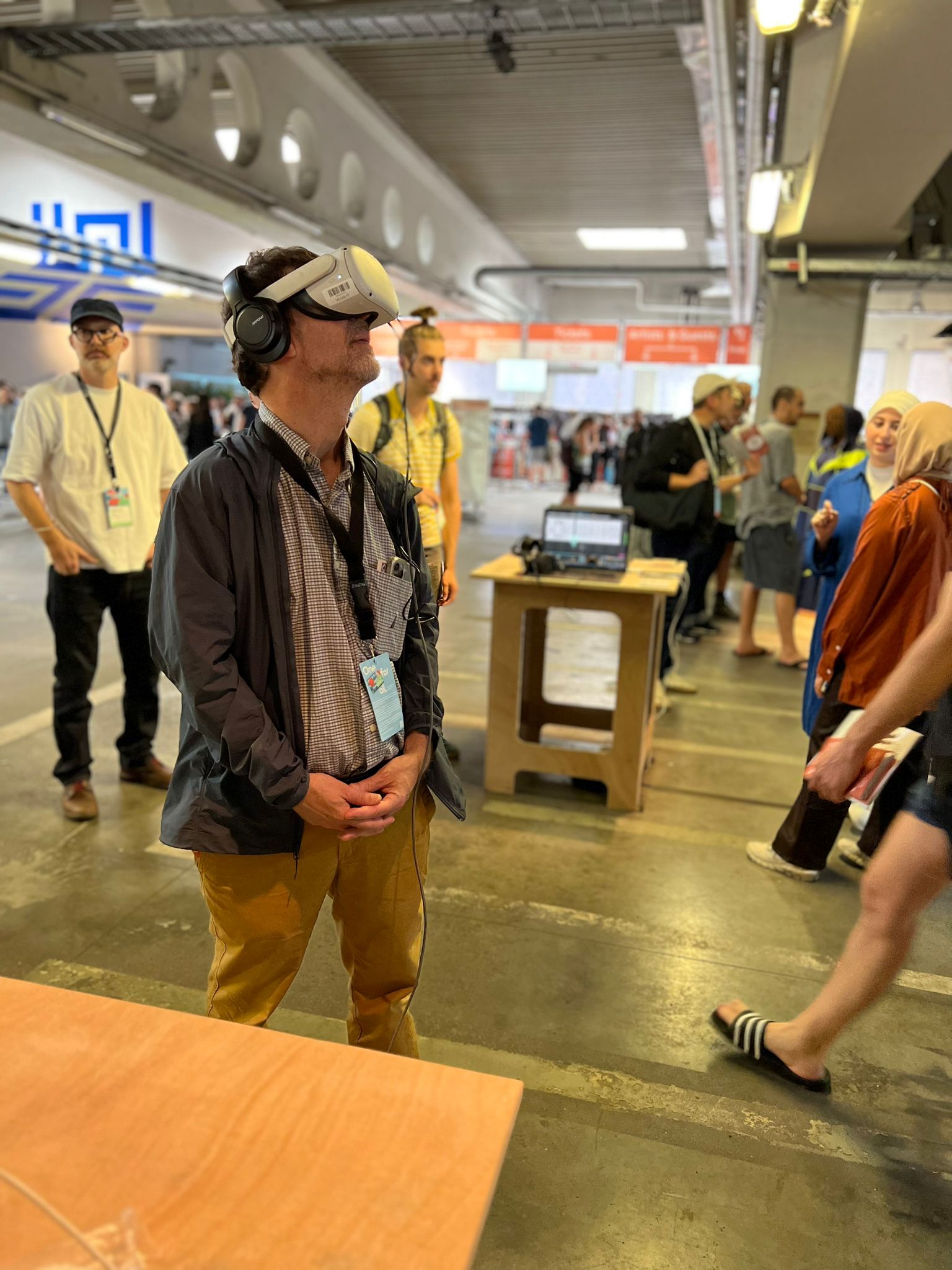 a visitor at the Vcuarts Qatar exhibition at Ars Electronica wearing a virtual reality headset