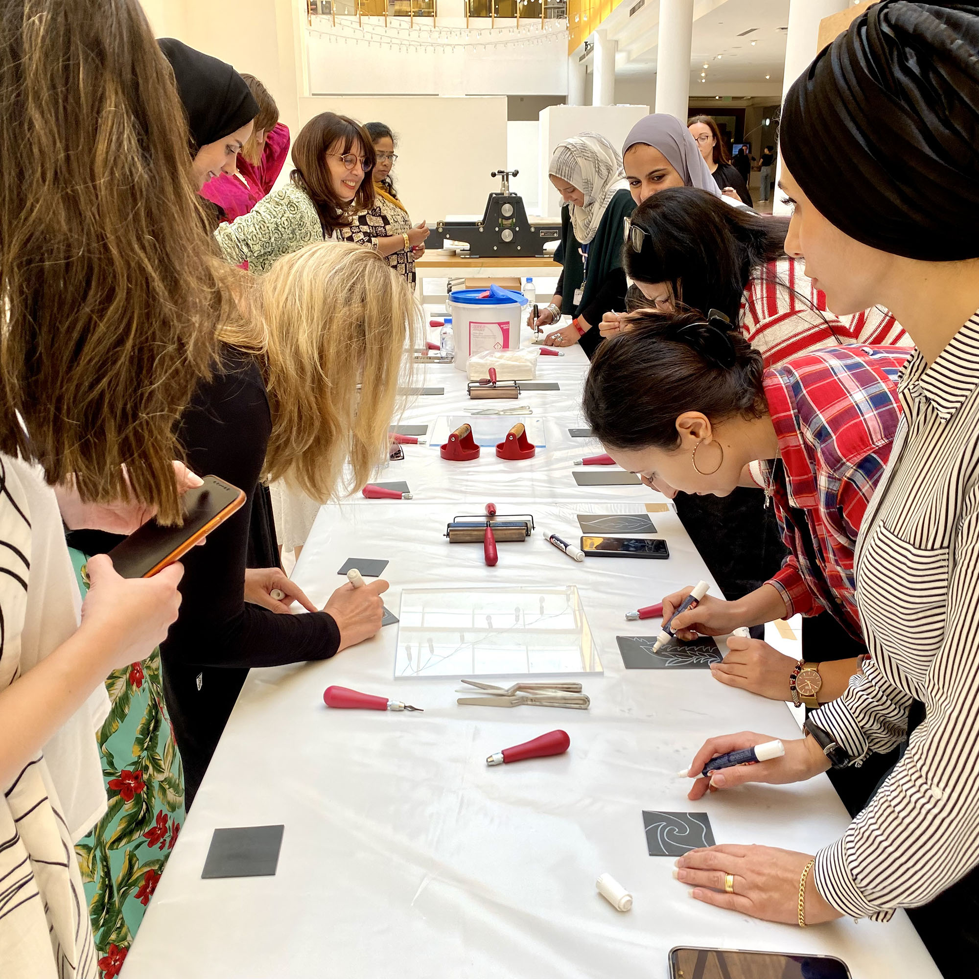 high school Art Teachers taking part in a painting and printmaking Workshop