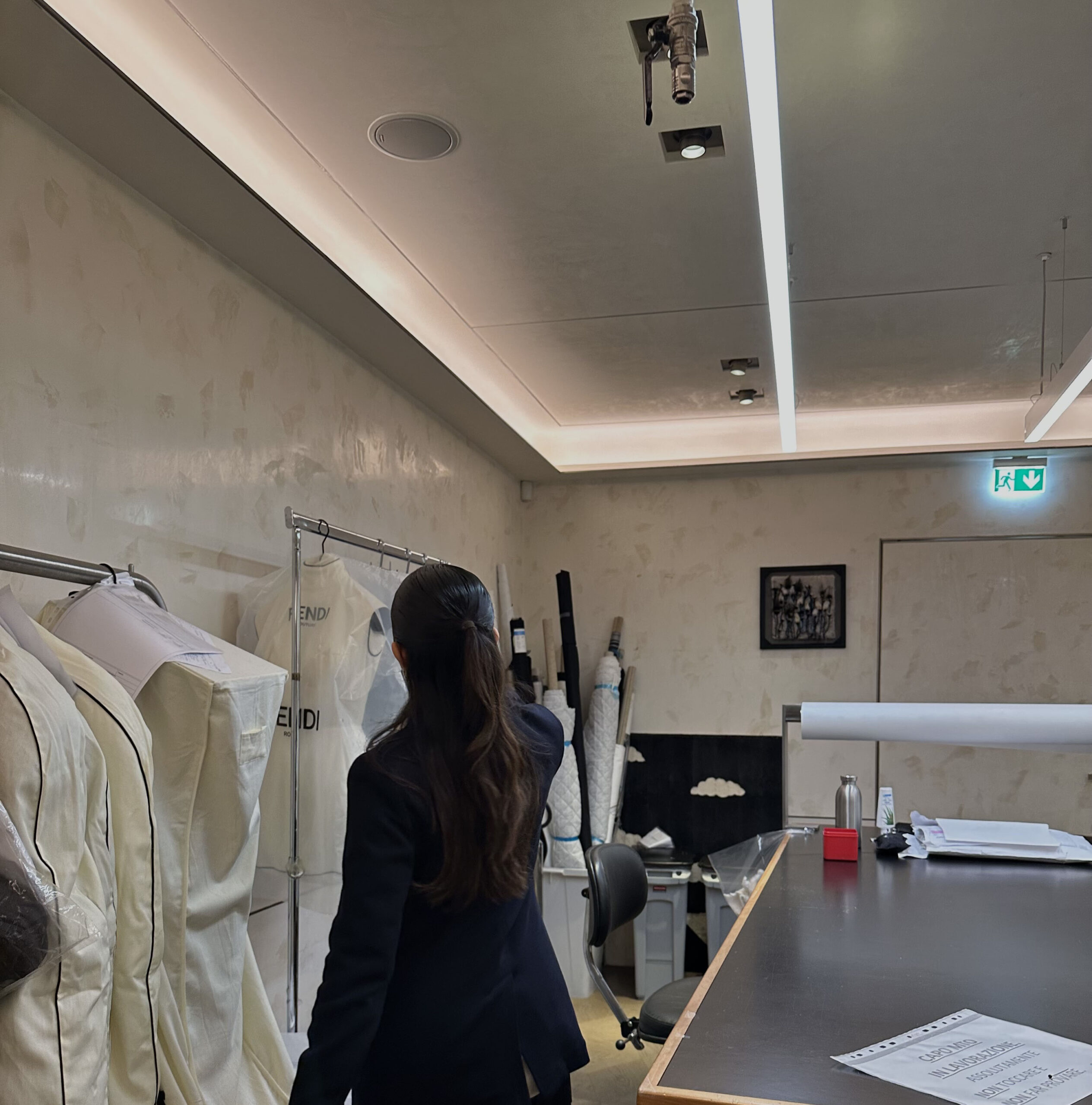 A fashion design student admiring garments during the trip to Italy