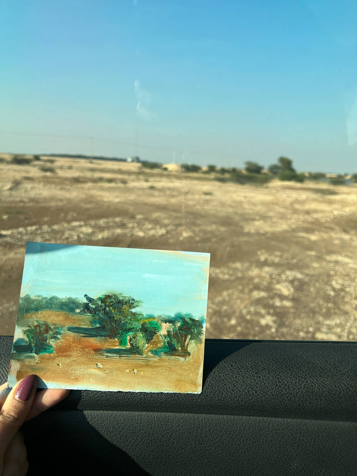 Hessa working on an oil painting on location in the desert