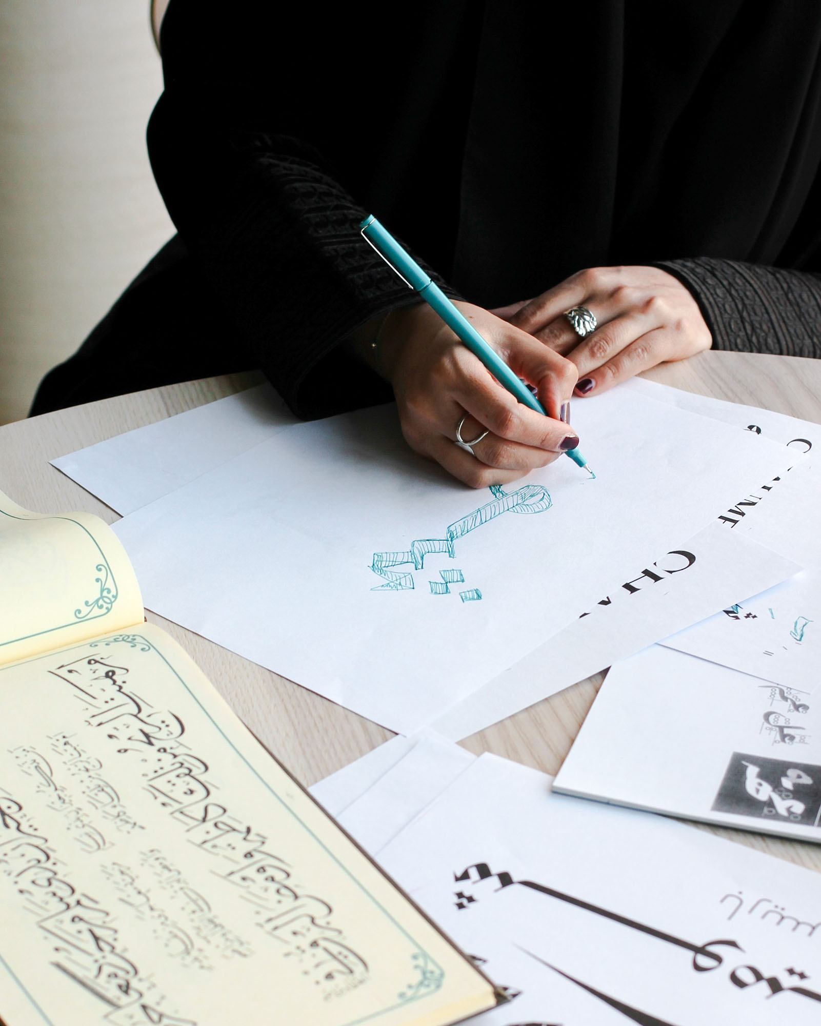 Zainab sketching out ideas on paper for the Chaumet project