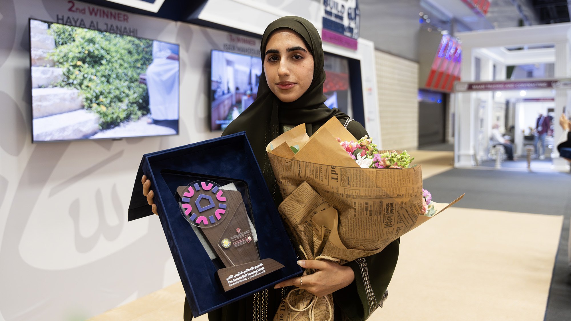 Haya with her award at the exhibition