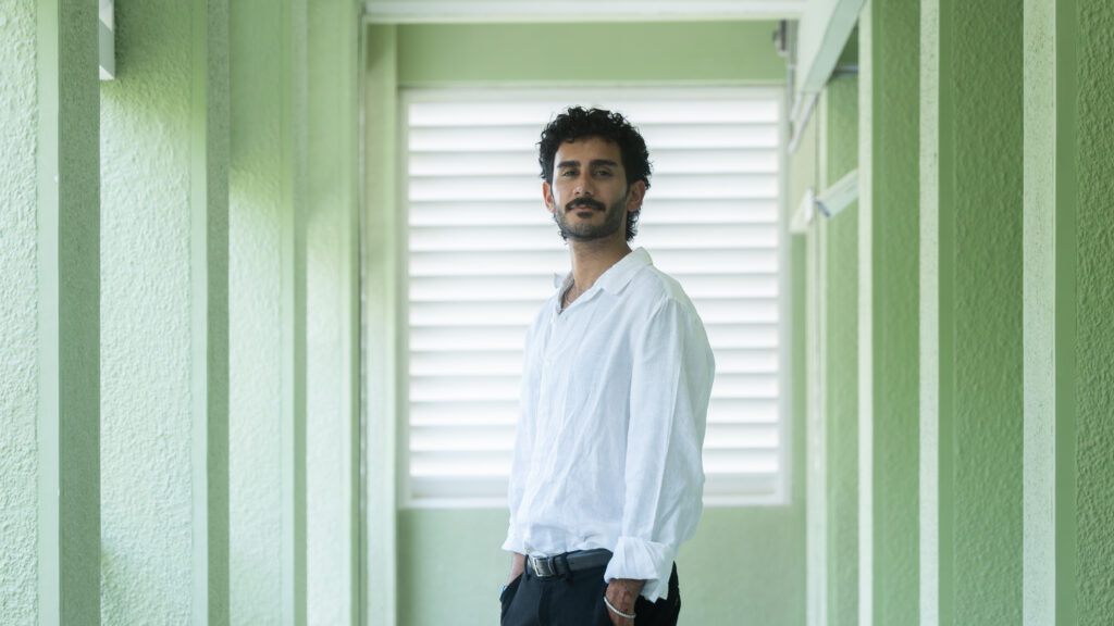 Man standing in front of window